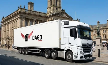 DAGO Express courier service truck in front of Huddersfield Railway Station and St Georges Square in Huddersfield