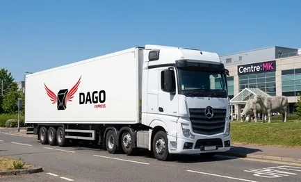 DAGO Express courier service truck in front of MK Rose monument and city centre boulevards in Milton Keynes